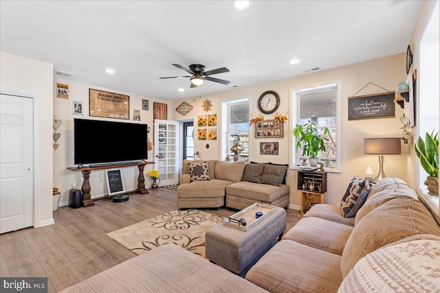 living area with recessed lighting, visible vents, ceiling fan, wood finished floors, and baseboards