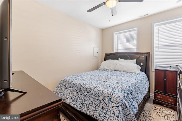 bedroom with visible vents and a ceiling fan