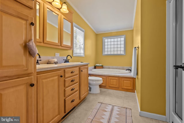 bathroom featuring a bath, crown molding, a sink, and tile patterned floors