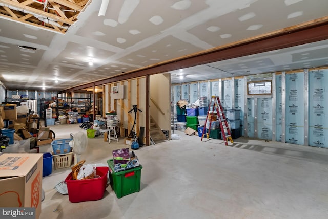 finished basement featuring stairs and visible vents