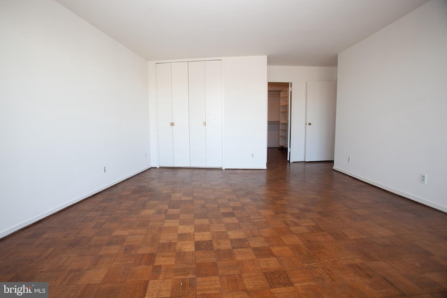 unfurnished bedroom with baseboards