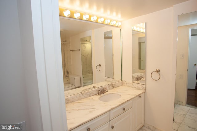 bathroom with walk in shower, toilet, marble finish floor, and vanity