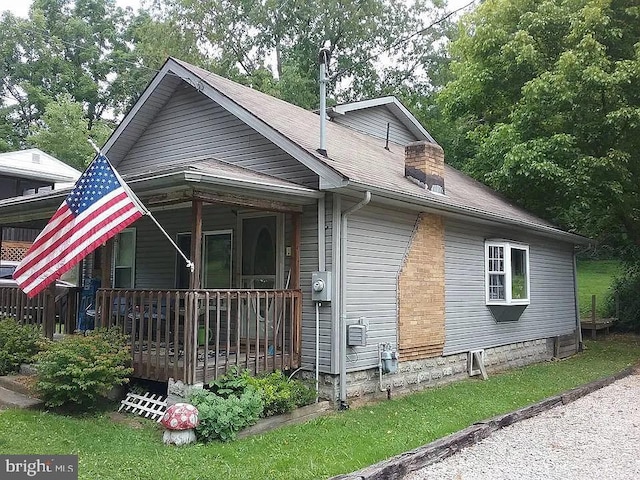 1511 Wilbur St, Parkersburg, WV 26101 - exterior space with roof with shingles and a chimney