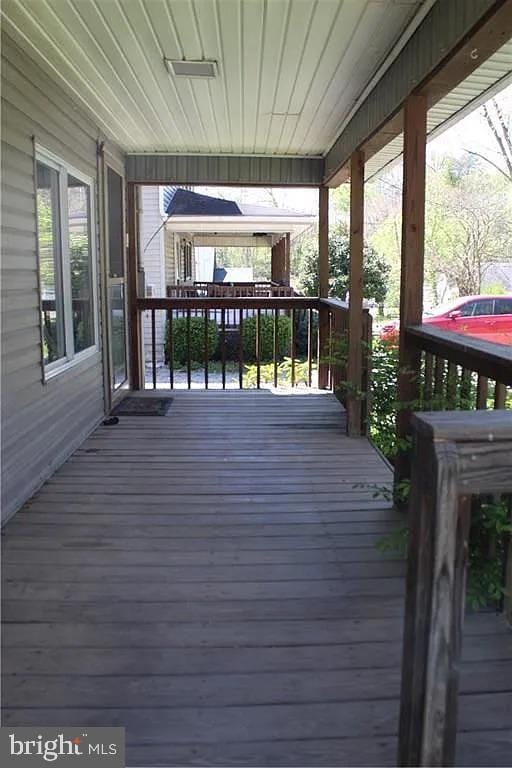 wooden deck with a porch