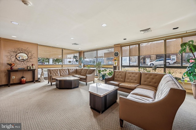 carpeted living room with recessed lighting and visible vents