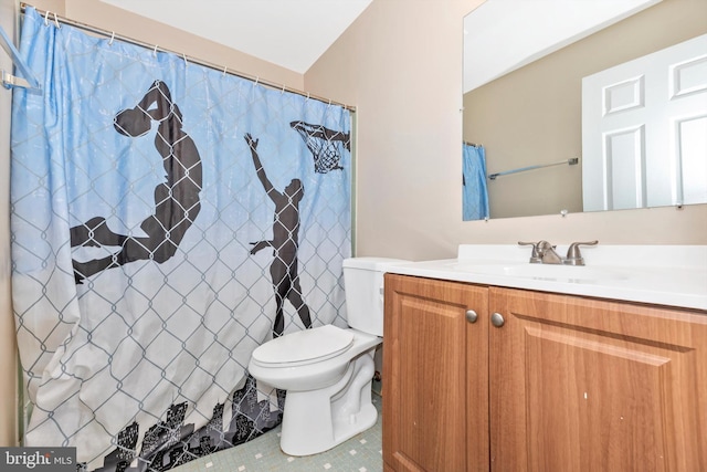 bathroom with vanity, curtained shower, toilet, and tile patterned flooring