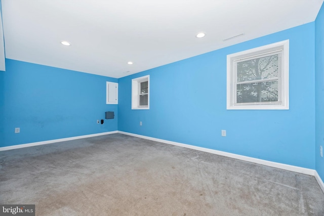 unfurnished room featuring recessed lighting, visible vents, baseboards, and carpet