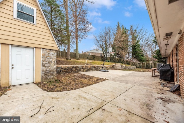 view of patio / terrace with area for grilling and a fenced backyard