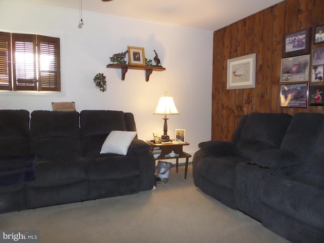 living room with wooden walls and carpet flooring