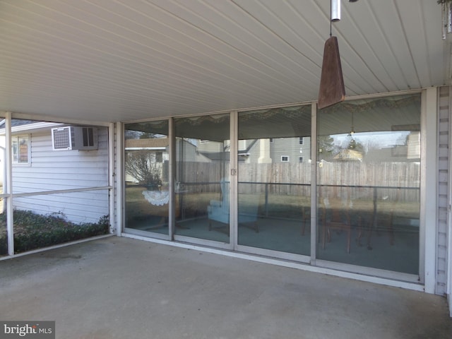 view of patio / terrace with a wall mounted AC