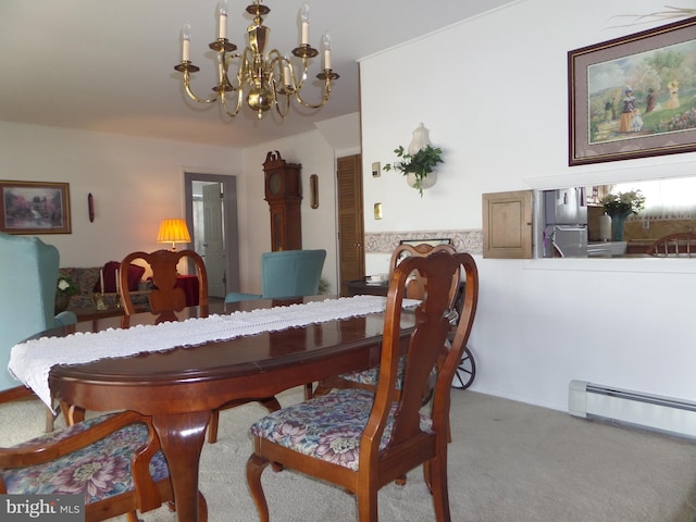 carpeted dining space featuring a baseboard heating unit and a chandelier