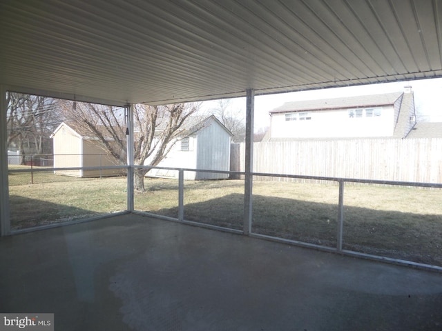 exterior space with an outdoor structure and a fenced backyard