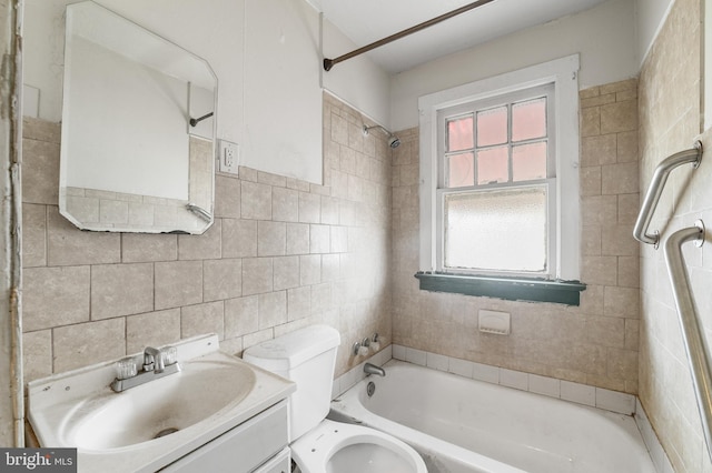 full bathroom featuring bathtub / shower combination, tile walls, toilet, and vanity