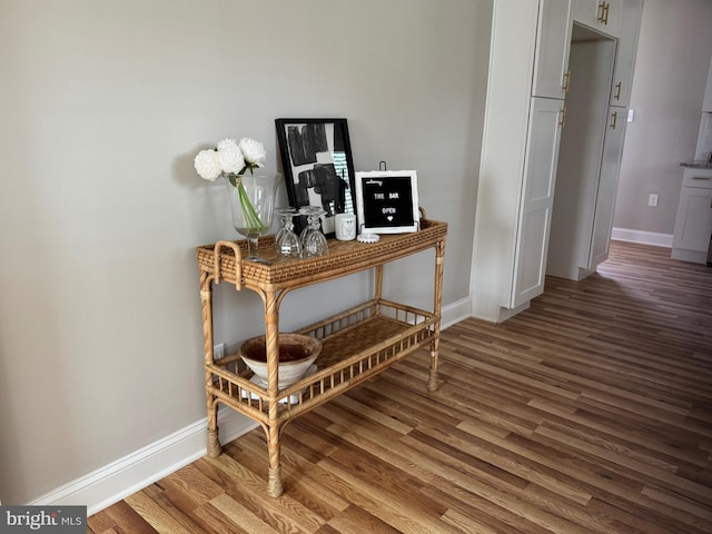 room details with baseboards and wood finished floors