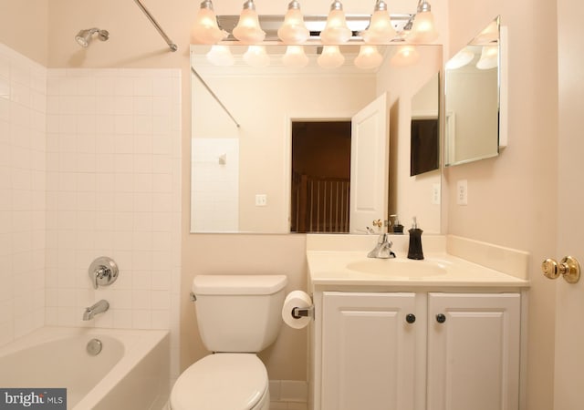 bathroom with shower / washtub combination, vanity, and toilet