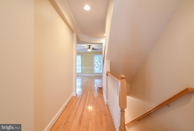 hall with recessed lighting, an upstairs landing, baseboards, light wood-style floors, and ornamental molding