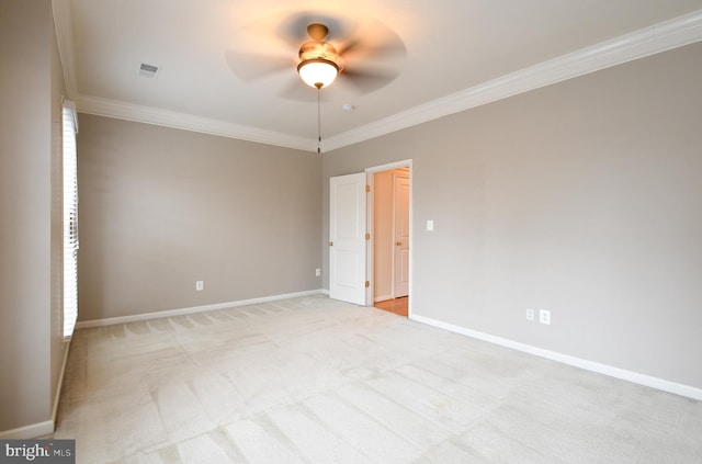 unfurnished room with baseboards, a ceiling fan, and ornamental molding