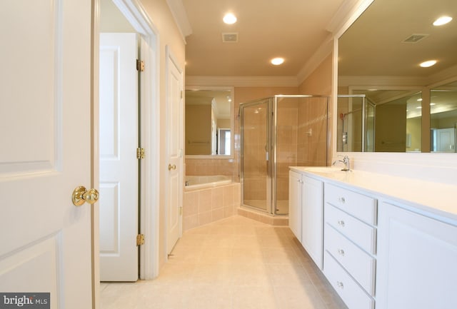 bathroom with ornamental molding, a stall shower, visible vents, and vanity