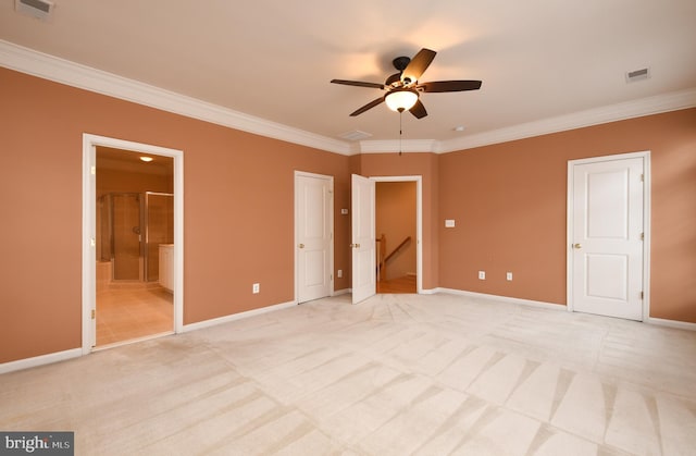 unfurnished bedroom featuring crown molding, baseboards, visible vents, and light colored carpet