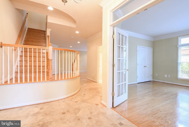 hallway featuring crown molding, stairway, baseboards, and wood finished floors