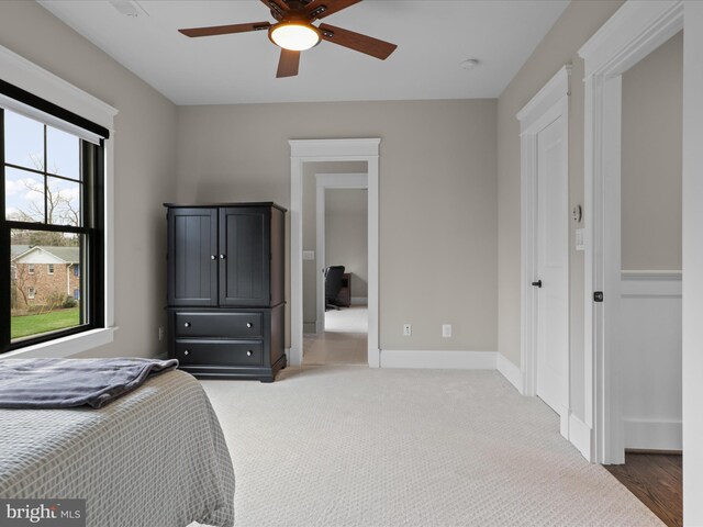 403 Colin Ln NW, Vienna, VA 22180 - bedroom featuring baseboards, light colored carpet, and ceiling fan