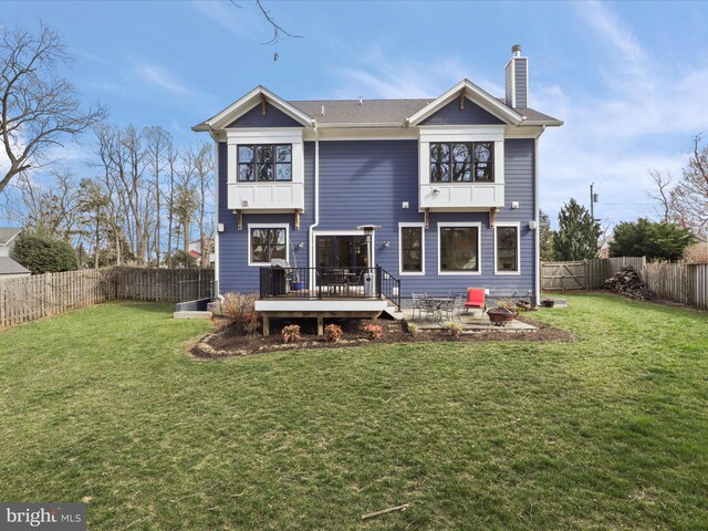 403 Colin Ln NW, Vienna, VA 22180 - back of property with a fenced backyard, a chimney, a wooden deck, and a yard