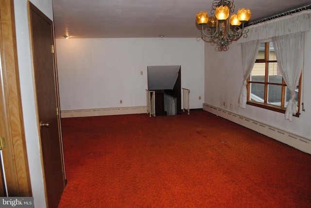 spare room with a baseboard heating unit, carpet, and a notable chandelier