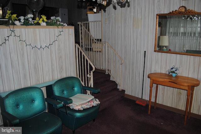 sitting room featuring stairs