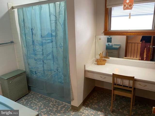 full bathroom featuring curtained shower and tile patterned flooring