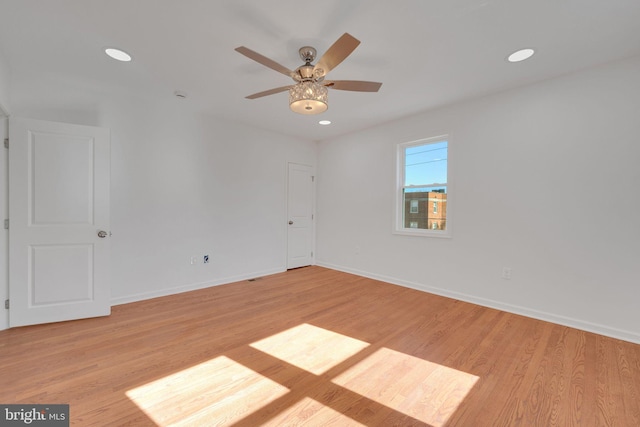 unfurnished room with recessed lighting, baseboards, and light wood finished floors