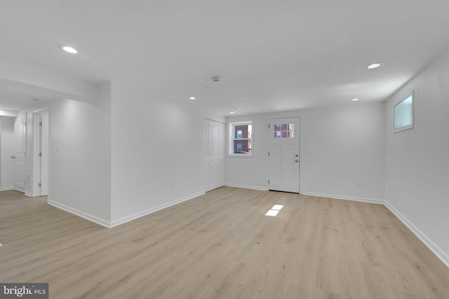 entryway with recessed lighting, baseboards, light wood-type flooring, and a wealth of natural light