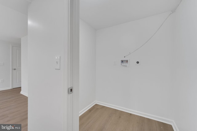 washroom featuring electric dryer hookup, light wood-style floors, hookup for a washing machine, and laundry area