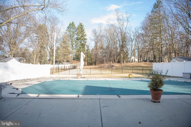 view of pool with a patio, fence, and a fenced in pool