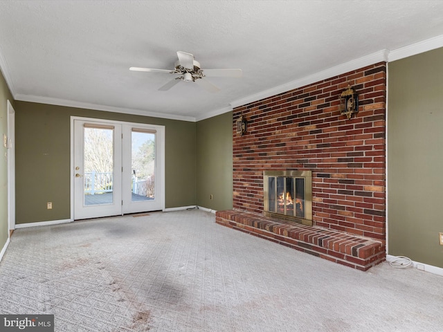 unfurnished living room featuring crown molding, a brick fireplace, baseboards, and a textured ceiling