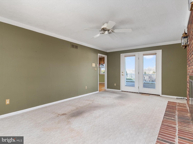 unfurnished living room with visible vents, carpet floors, a textured ceiling, and crown molding