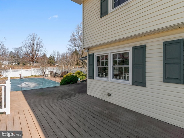 wooden terrace featuring a fenced backyard