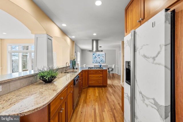 kitchen with extractor fan, dishwashing machine, a peninsula, white refrigerator with ice dispenser, and a sink