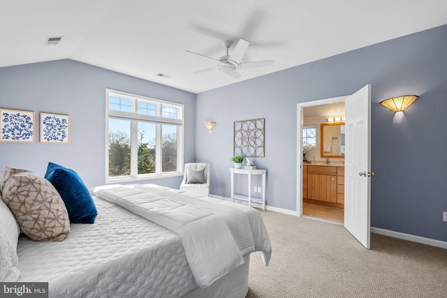 bedroom with visible vents, light carpet, lofted ceiling, and baseboards