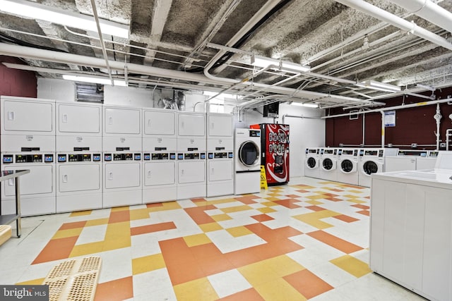 common laundry area featuring tile patterned floors, independent washer and dryer, and stacked washer / dryer