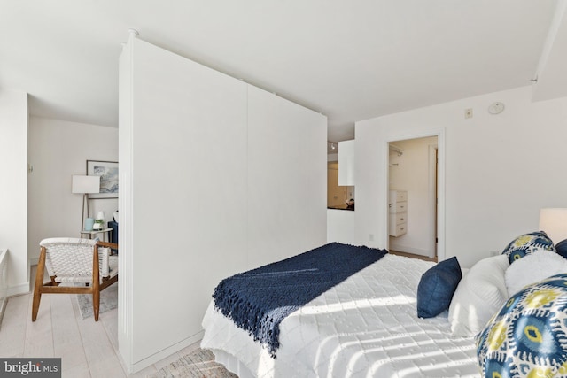 bedroom with light wood-style floors