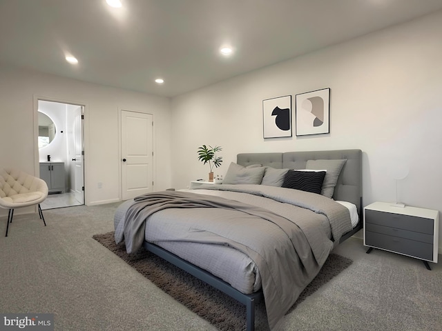 carpeted bedroom featuring recessed lighting, baseboards, and ensuite bathroom