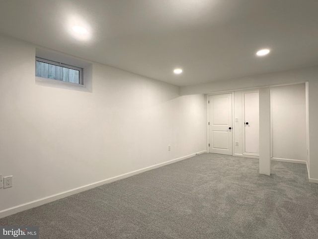 basement featuring carpet floors, baseboards, and recessed lighting