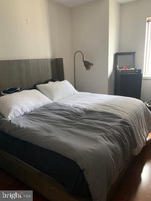 bedroom with wood finished floors