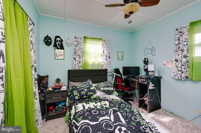 bedroom with multiple windows and a ceiling fan