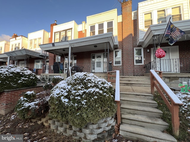 townhome / multi-family property with brick siding