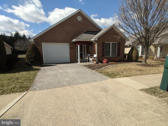 view of front of house with a garage, driveway, a shingled roof, and brick siding