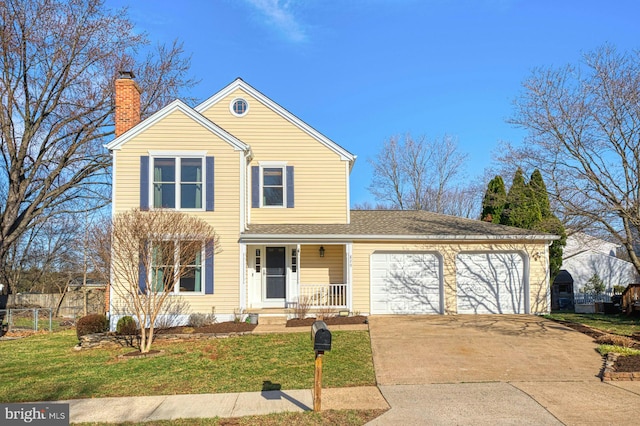 traditional-style home featuring a garage, a front lawn, a porch, and driveway