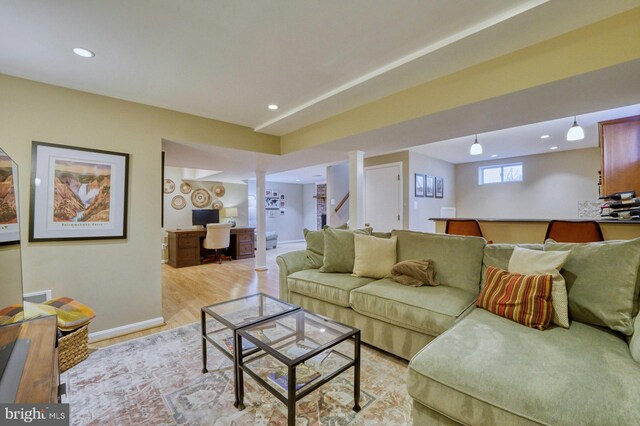 living area with recessed lighting, light wood-type flooring, and baseboards