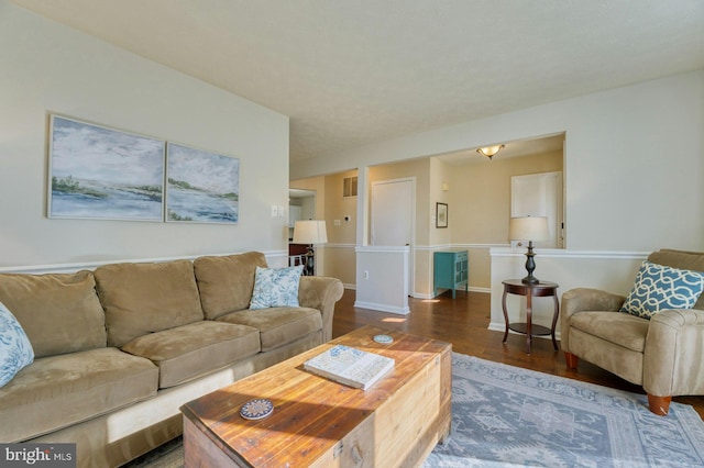 living room featuring wood finished floors and baseboards