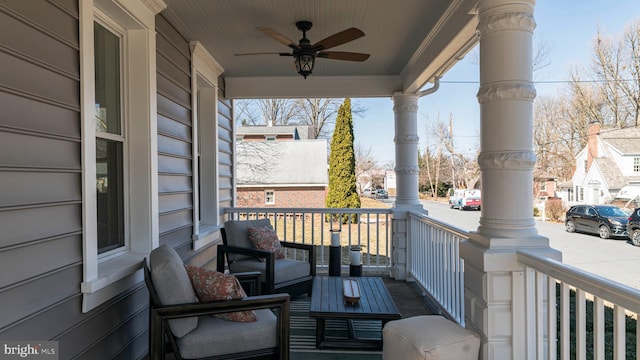 deck featuring a porch and ceiling fan